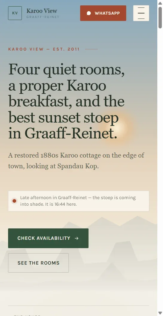 The same Karoo View home page on a phone: the headline stacked over the horizon, with the WhatsApp button in reach of a thumb.